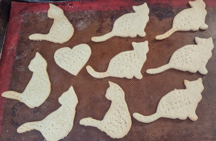 Cooked crackers shaped like cats and hearts.